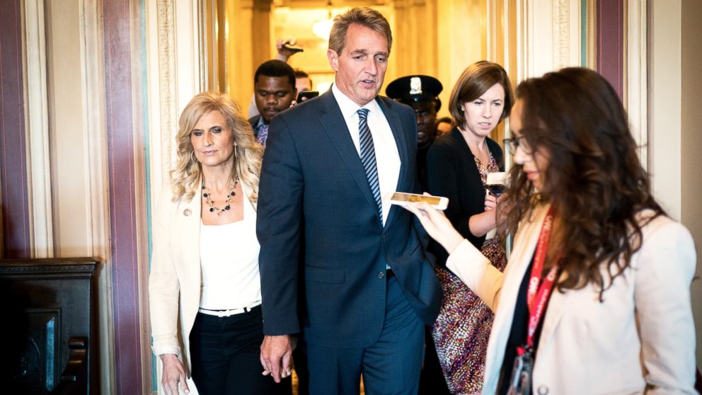 PHOTO: Sen. Jeff Flake walks with his wife, Cheryl, on Capitol Hill in Washington, Oct. 3, 2018.