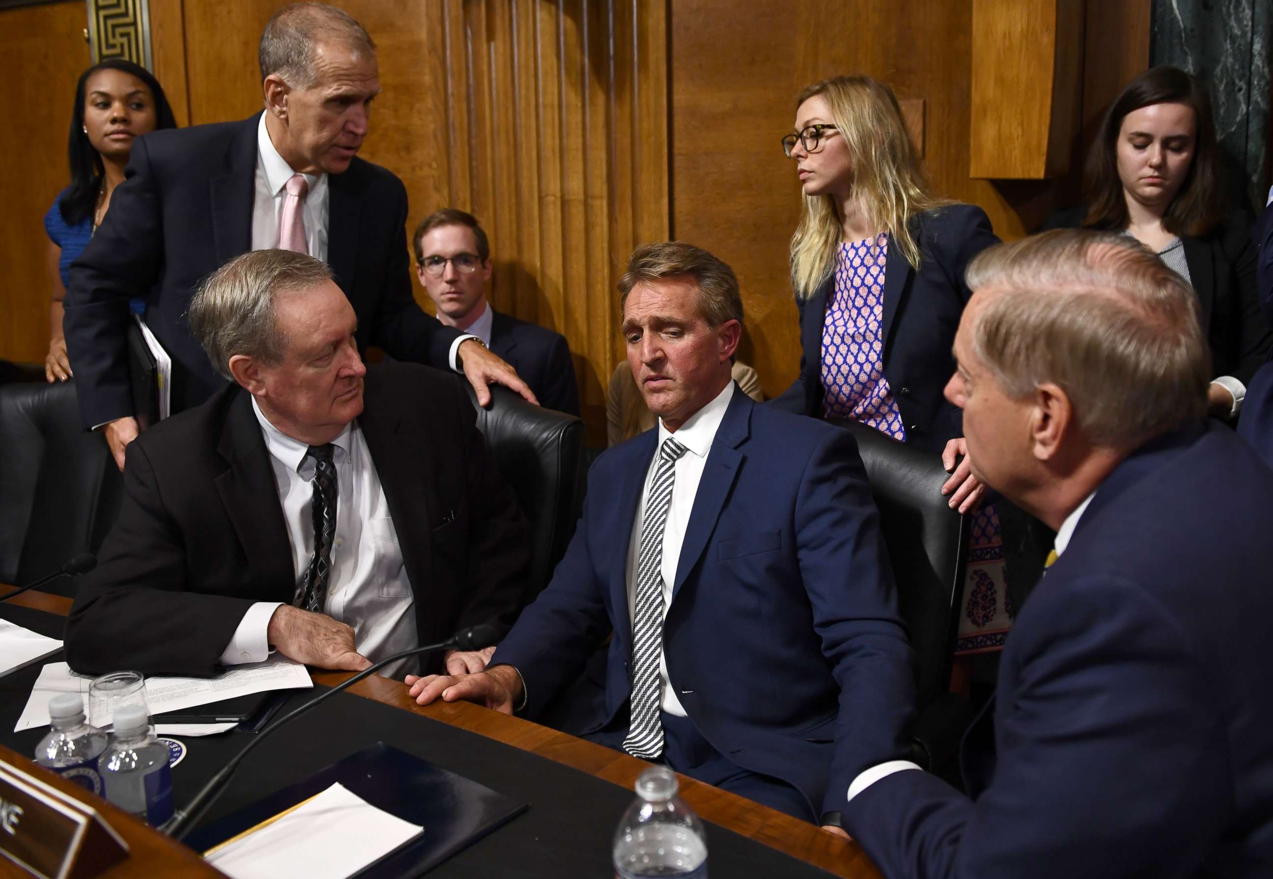 Senate Judiciary Committee member Sen. Jeff Flake speaks with committee colleagues during a hearing in Washington on Sept. 28, 2018, after requested a delay for a floor vote to allow for an FBI investigation.