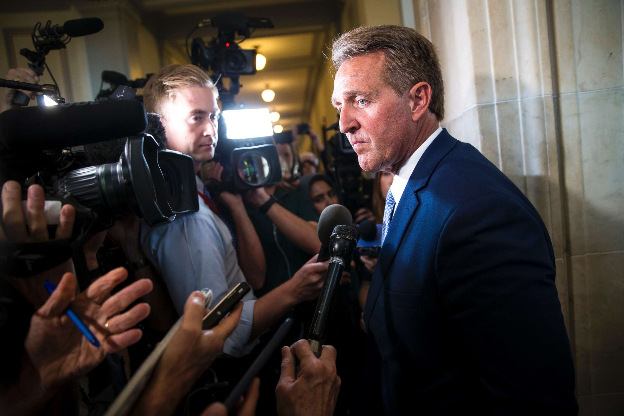 PHOTO: Sen. Jeff Flake speaks with reporters following his announcement he would not be running for re-election in 2018, on Capitol Hill in Washington, Oct. 24, 2017.