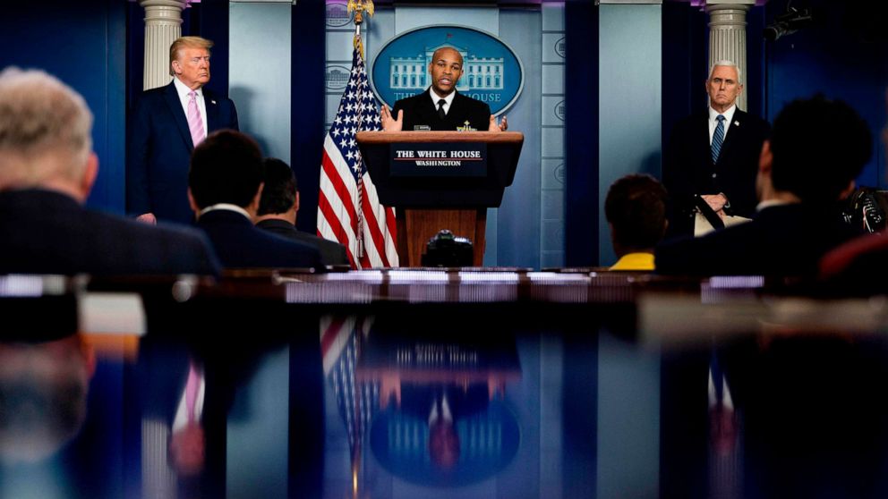 PHOTO: Surgeon General Jerome Adams speaks, flanked by President Donald Trump and Vice President Mike Pence, during the daily briefing on the novel coronavirus at the White House, on April 10, 2020, in Washington.