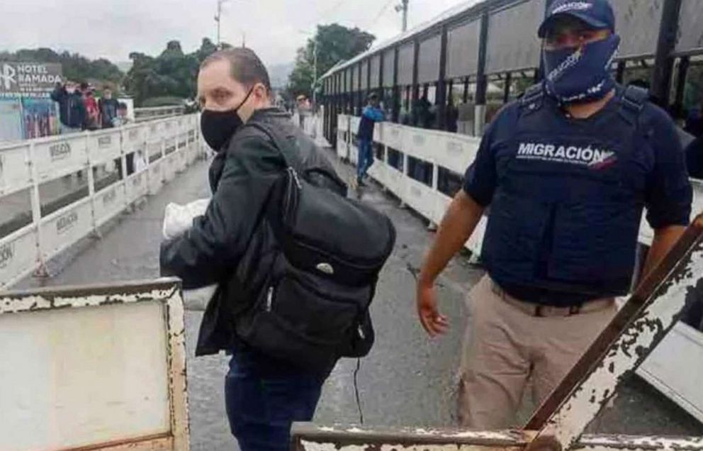 PHOTO: Jerrel Kenemore stands at a Colombian checkpoint in the middle of the Simon Bolivar international bridge connecting San Antonio del Tachira, Venezuela with Villa del Rosario, Colombia, the second week of March 2022.