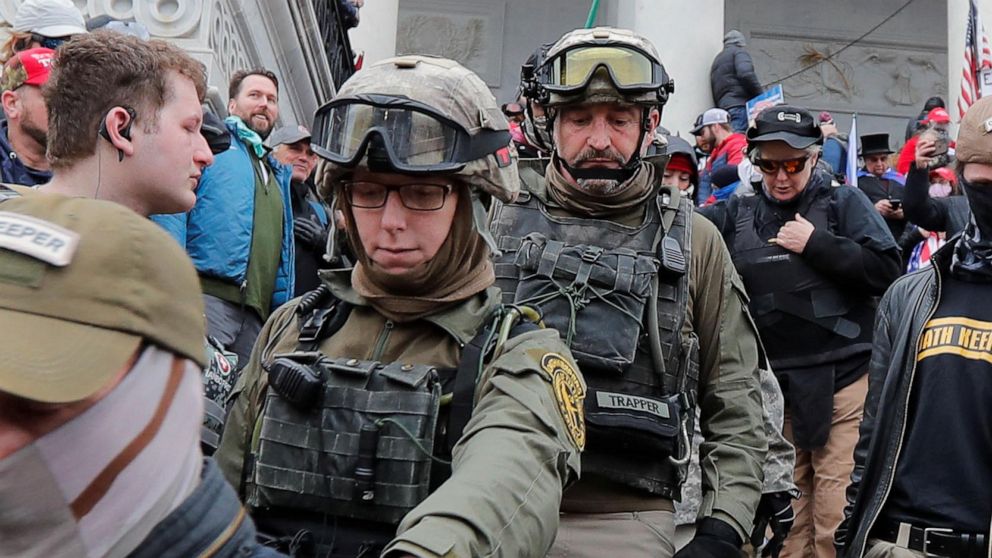 PHOTO: Jessica Watkins marches down the East front steps of the U.S. Capitol with the Oath Keepers militia group among supporters of President Donald Trump occupying the steps in Washington, D.C., on January 6, 2021.