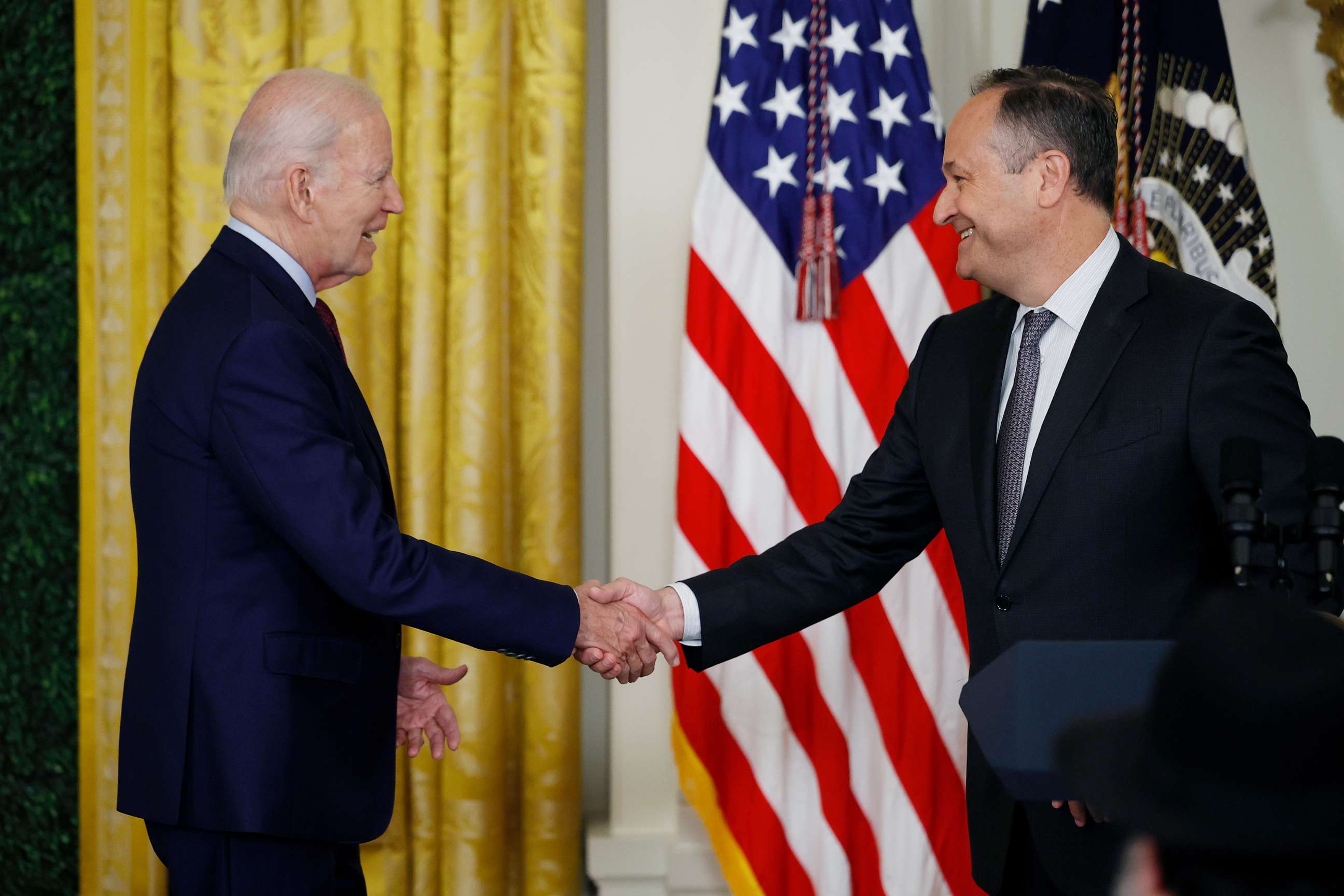 PHOTO: President Joe Biden is introduced by second gentleman Doug Emhoff during a celebration marking Jewish American Heritage Month in the East Room of the White House on May 16, 2023 in Washington, DC.