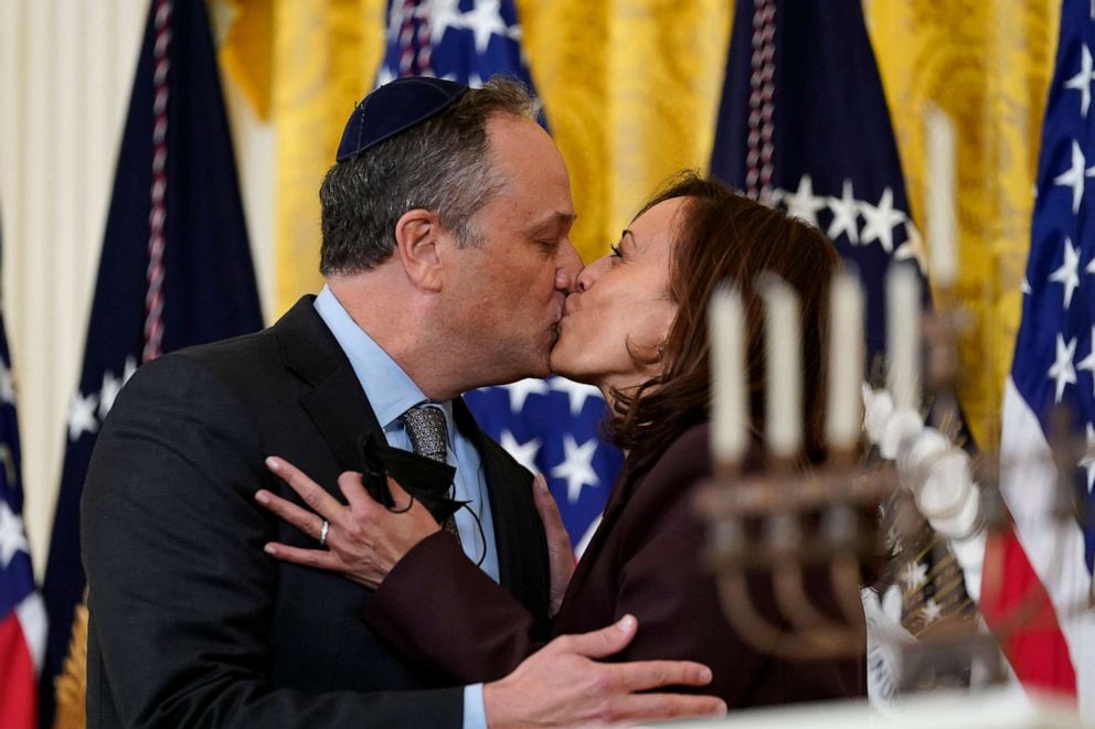 PHOTO: Vice President Kamala Harris and second gentleman Doug Emhoff kiss during an event in the East Room of the White House to light the menorah to celebrate Hanukkah in Washington, Dec. 1, 2021. 
