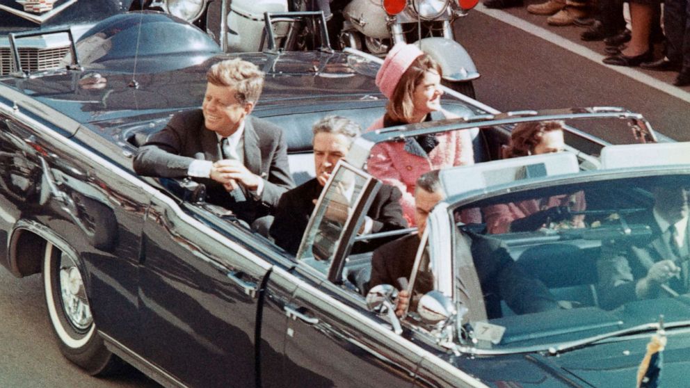PHOTO: President John F Kennedy, First Lady Jacqueline Kennedy, Texas Governor John Connally, and others smile at the crowds lining their motorcade route in Dallas, Nov. 22, 1963.