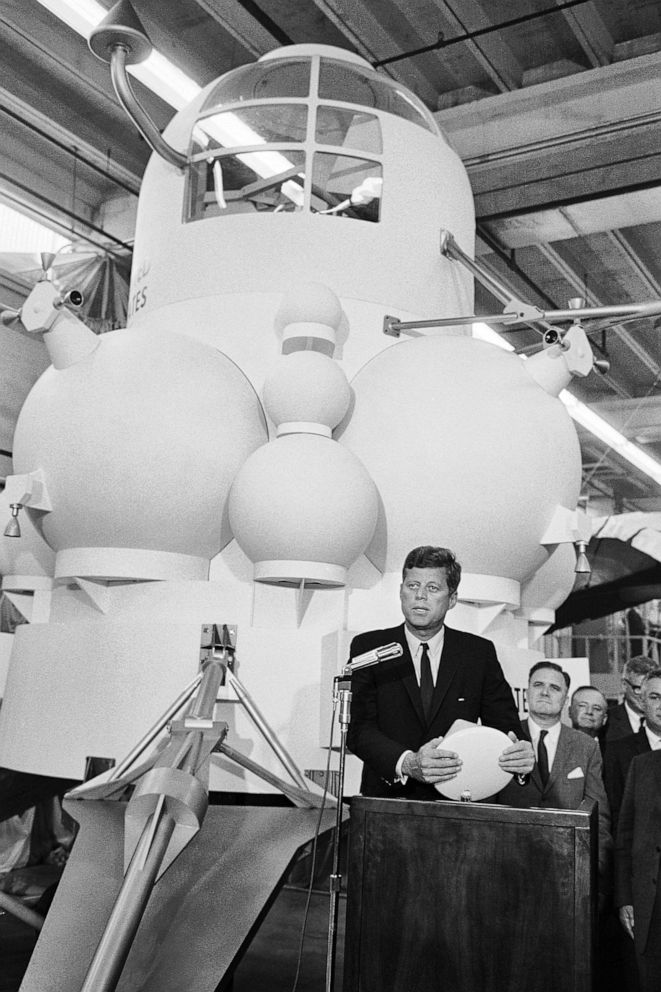 PHOTO: President John F. Kennedy speaks from a lectern in front of a full-size model of the projected design for a lunar landing module during a visit to the Manned Spacecraft Center (later renamed the Lyndon B. Johnson Space Center), Houston, Texas.