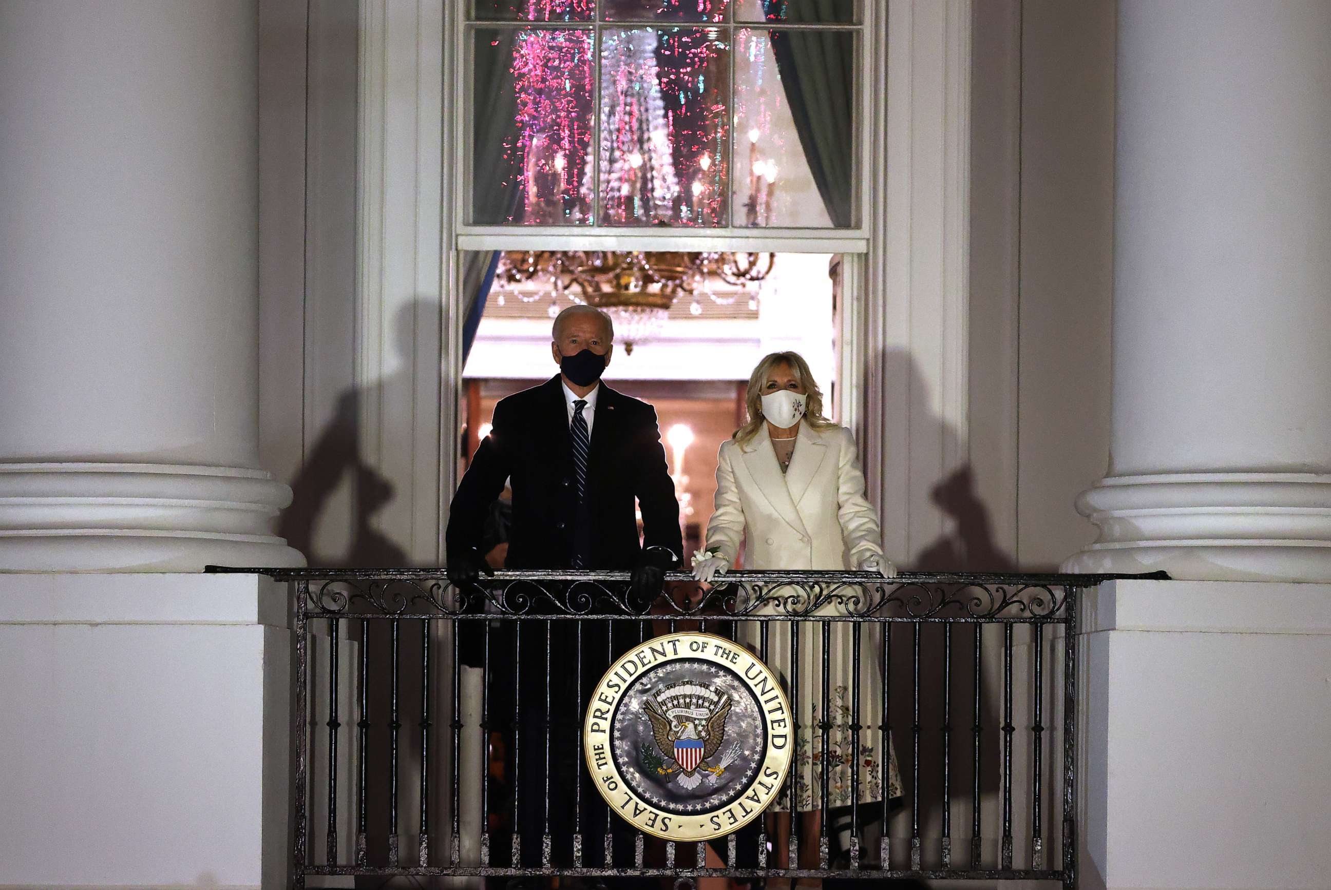 PHOTO: President Joe Biden and first lady Jill Biden watch a fireworks show celebrating his inauguration on the National Mall from the Truman Balcony at the White House Jan. 20, 2021, in Washington.