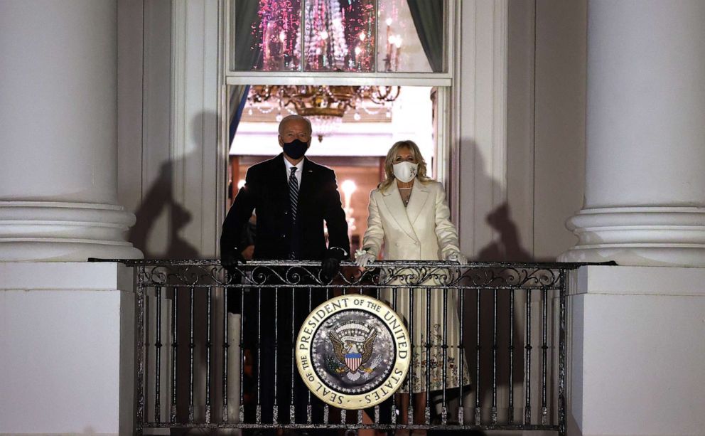 PHOTO: President Joe Biden and first lady Jill Biden watch a fireworks show celebrating his inauguration on the National Mall from the Truman Balcony at the White House Jan. 20, 2021, in Washington.