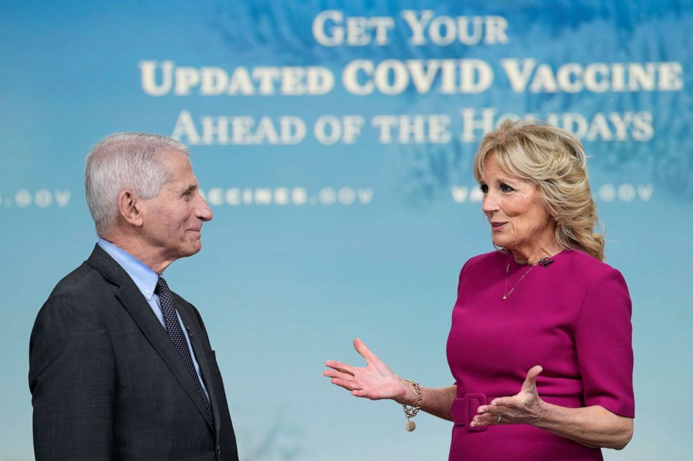 PHOTO: First lady Jill Biden, standing with Dr. Anthony Fauci, speaks on getting an updated COVID-19 vaccine this holiday season during the opening remarks of a virtual White House town hall in Washington, Dec. 9, 2022.