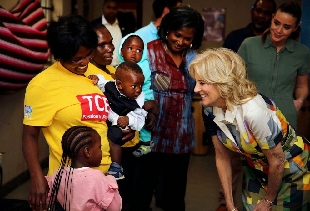 PHOTO: U.S. First Lady Jill Biden, right, reacts during a visit to a U.S. President's Emergency Plan for AIDS Relief (PEPFAR) project at an informal settlement near Windhoek, Namibia, Feb. 23, 2023.