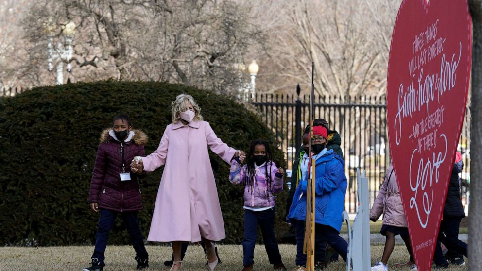 PHOTO: First lady Jill Biden walks with second graders from a DC elementary school to celebrate Valentines Day on the North Lawn at the White House in Washington, D.C., Feb. 14, 2022.