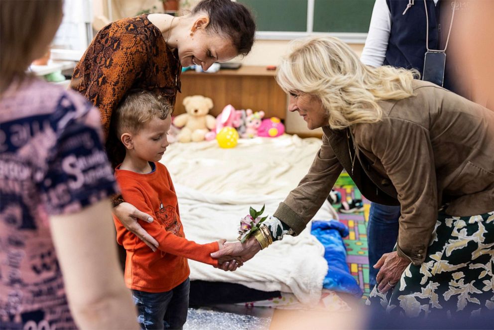 PHOTO: First Lady Jill Biden greets a displaced child evacuated during a visit to an internally displaced persons center with Ukrainian First Lady Olena Zelenska, at School #6, May 8, 2022, in Uzhhorod, Ukraine.