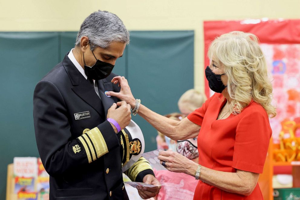 PHOTO: First lady Jill Biden puts a vaccination sticker on Dr. Vivek Murthy, the U.S. Surgeon General, as they visit a pediatric COVID-19 vaccination clinic at Franklin Sherman Elementary School in McLean, Va, Nov. 8, 2021. 