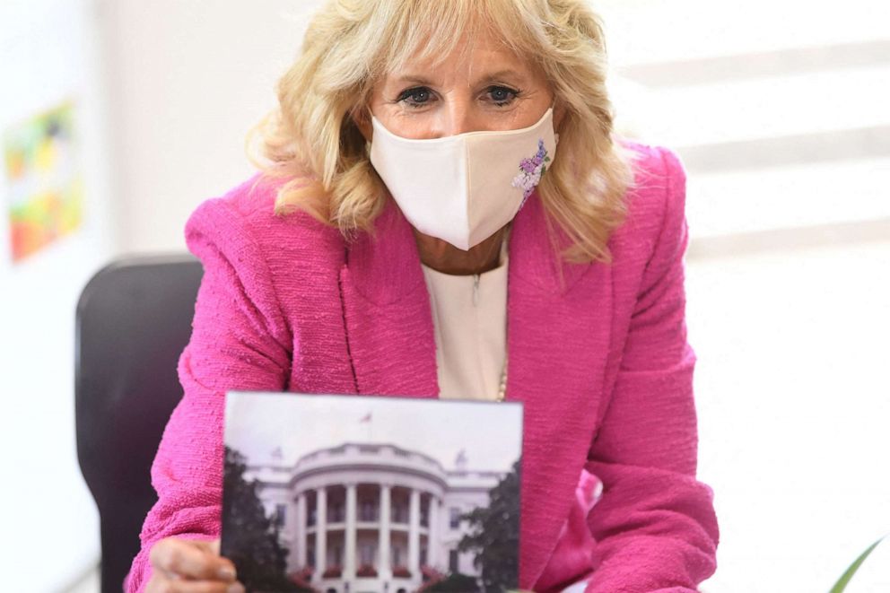 PHOTO: First lady Jill Biden shows a picture of the White House as she visits Connor Downs Academy in Hayle, Cornwall on the sidelines of the G7 summit, June 11, 2021.