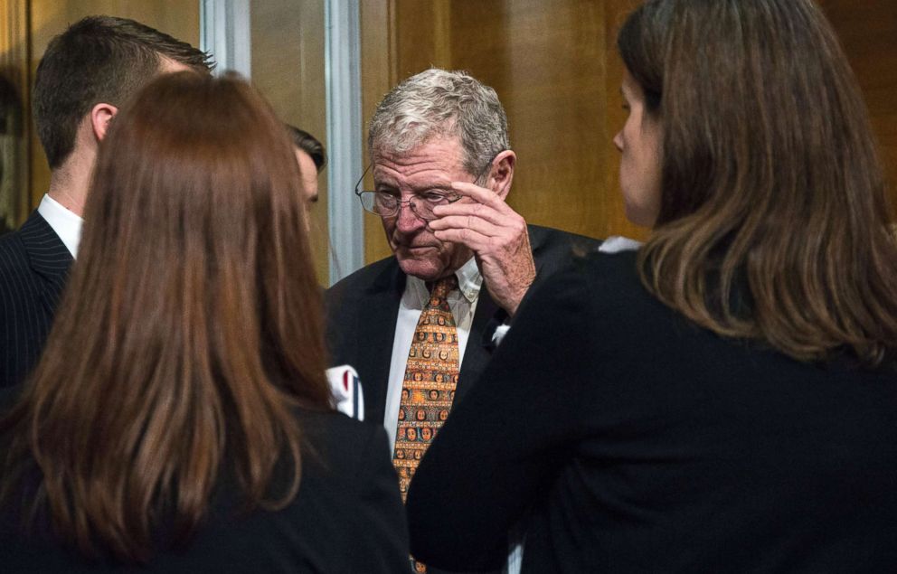 PHOTO: Sen. Jim Inhofe talks with other attendees at the Senate Environment and Public Works Committee confirmation hearing for Scott Pruitt, on Capitol Hill, Jan, 18, 2017, in Washington, D.C. 