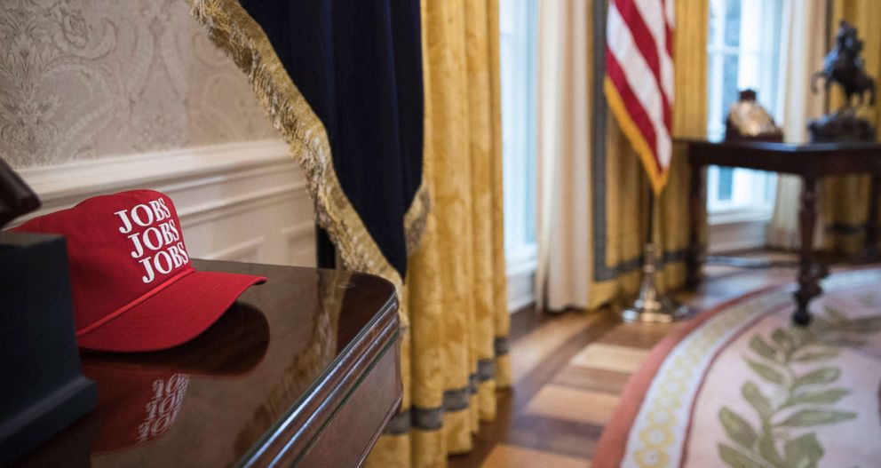 PHOTO: A red hat with "Jobs, Jobs, Jobs" printed on it rests on a table in the Oval Office, Jan. 31, 2018.