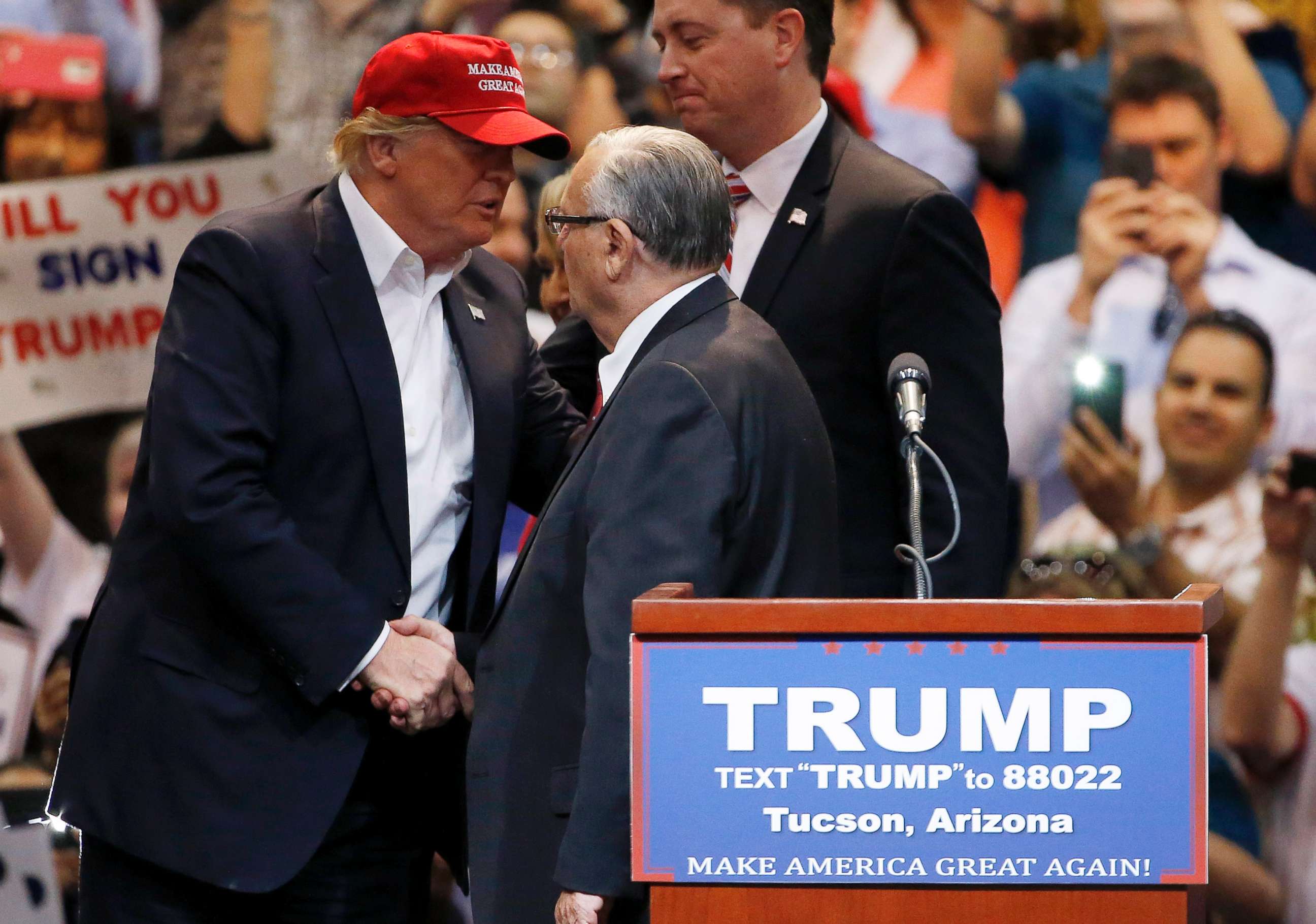 PHOTO: Then presidential candidate Donald Trump shakes hands with Maricopa County Sheriff Joe Arpaio prior to speaking at a campaign rally, March 19, 2016, in Tucson, Ariz.