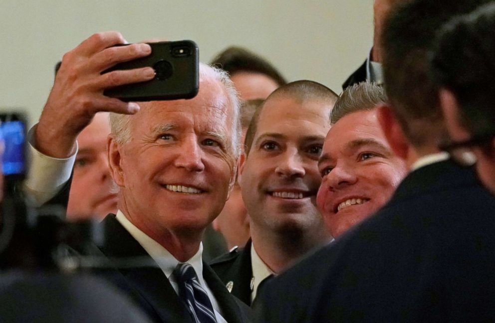 PHOTO: Former Vice President Joe Biden poses for a selfie after addressing the International Association of Fire Fighters in Washington, March 12, 2019.