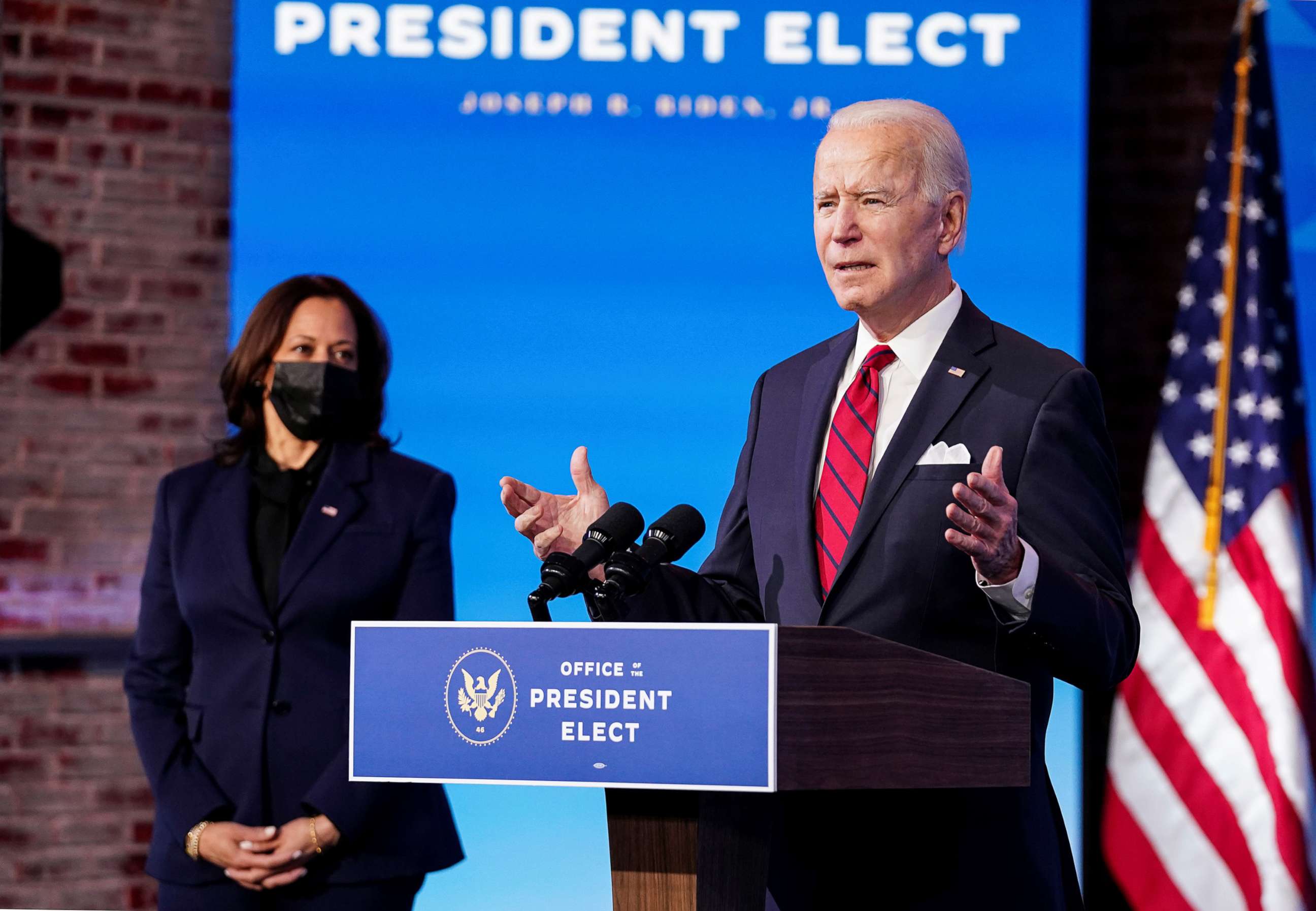 PHOTO: President-elect Joe Biden speaks about his plan to administer coronavirus disease vaccines as Vice President-elect Kamala Harris listens during a news conference at Biden's transition headquarters in Wilmington, Del., Jan. 15, 2021.