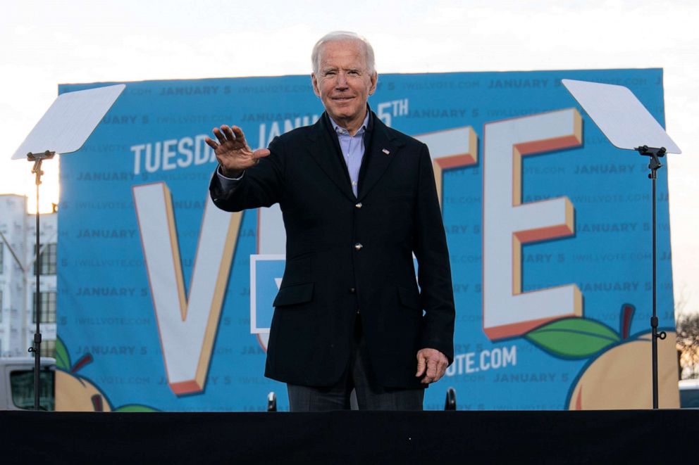 PHOTO: President-elect Joe Biden waves from the stage as he campaigns for for Georgia Democratic candidates for U.S. Senate, Rev. Raphael Warnock and Jon Ossoff in Atlanta, Jan. 4, 2021.