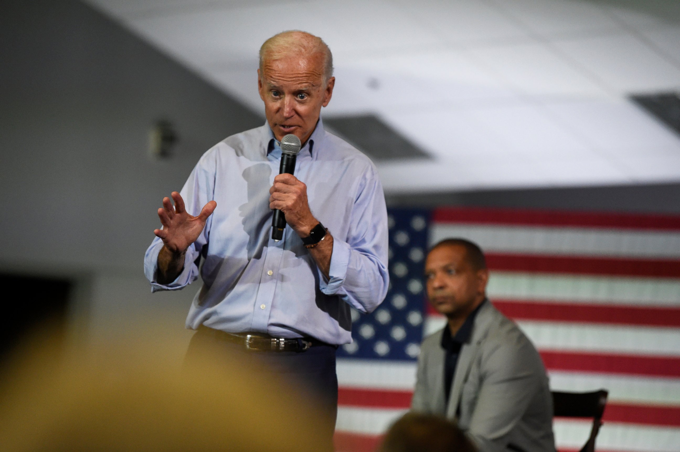 PHOTO: Democratic presidential candidate and former Vice President Joe Biden speaks at a town hall on Sunday, July 7, 2019, in Charleston, S.C., as state Sen. Marlon Kimpson looks on.