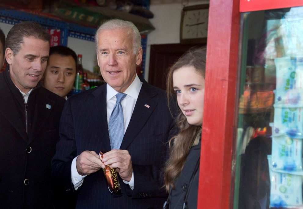 PHOTO: In this file photo, Vice President Joe Biden, center, buys an ice-cream at a shop as he tours a Hutong alley with his granddaughter Finnegan Biden, right, and son Hunter Biden, left, in Beijing, China on Dec. 5, 2013.