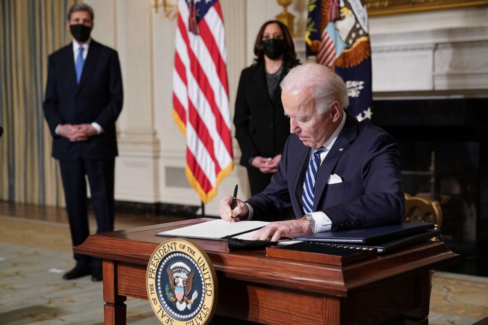 PHOTO: President Joe Biden signs executive orders after speaking on tackling climate change, creating jobs, and restoring scientific integrity in the State Dining Room of the White House in Washington, D.C., Jan. 27, 2021.