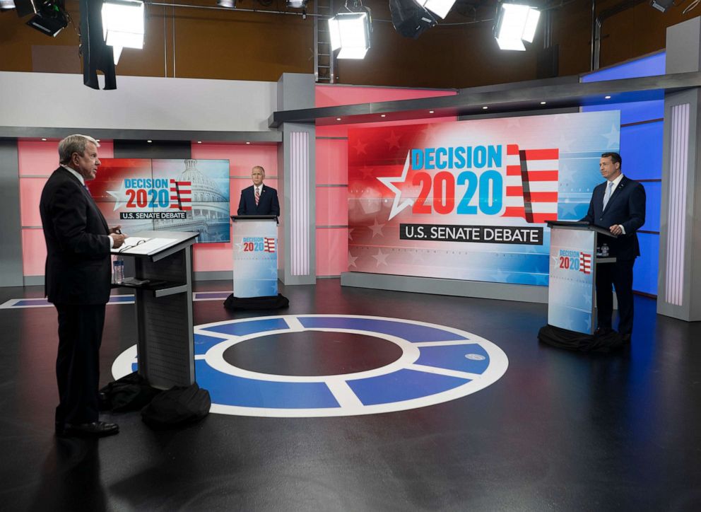 PHOTO: Sen. Thom Tillis and Democratic challenger Cal Cunningham participate in a televised debate moderated by WRAL anchor David Crabtree in Raliegh, N.C.,Sept. 14, 2020.