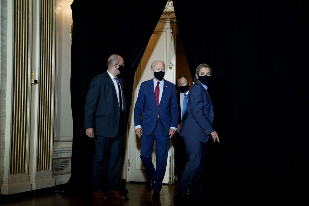 PHOTO: Former Vice President Joe Biden arrives to deliver remarks following a coronavirus briefing with health experts at the Hotel DuPont on Aug. 13, 2020, in Wilmington, Del.