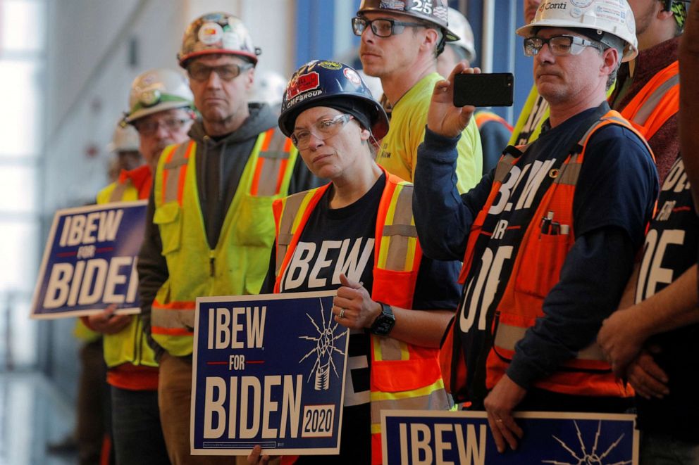 PHOTO: Workers are seen during a visit by Democratic presidential candidate and former Vice President Joe Biden at the FCA Mack Assembly plant in Detroit, March 10, 2020.