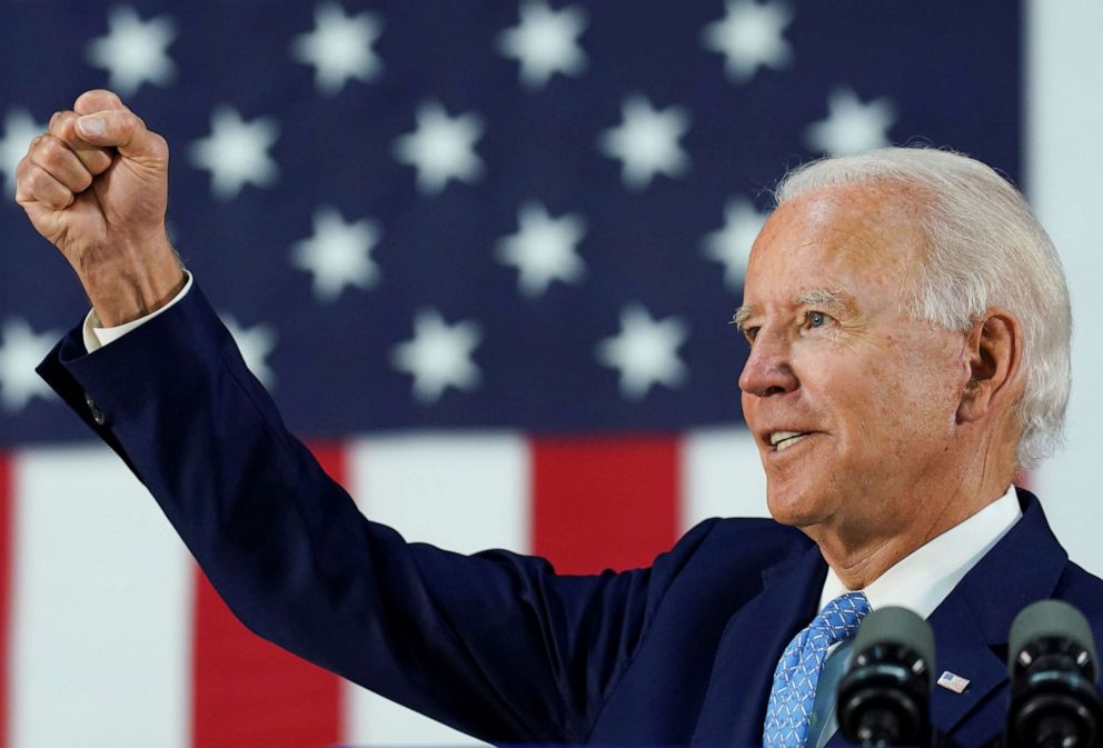 PHOTO: Democratic presidential candidate and former Vice President Joe Biden thrusts his fist while answering questions from reporters during a campaign event in Wilmington, Delaware, June 30, 2020.