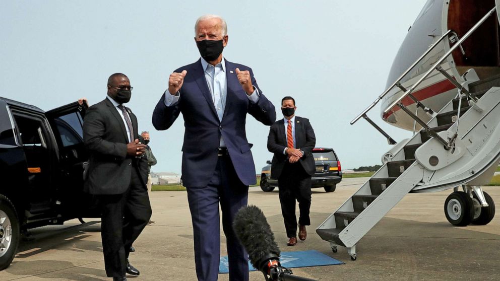 PHOTO: Democratic presidential nominee Joe Biden talks to reporters as he departs for travel to Florida from New Castle Airport in New Castle, Del., Sept. 15, 2020.