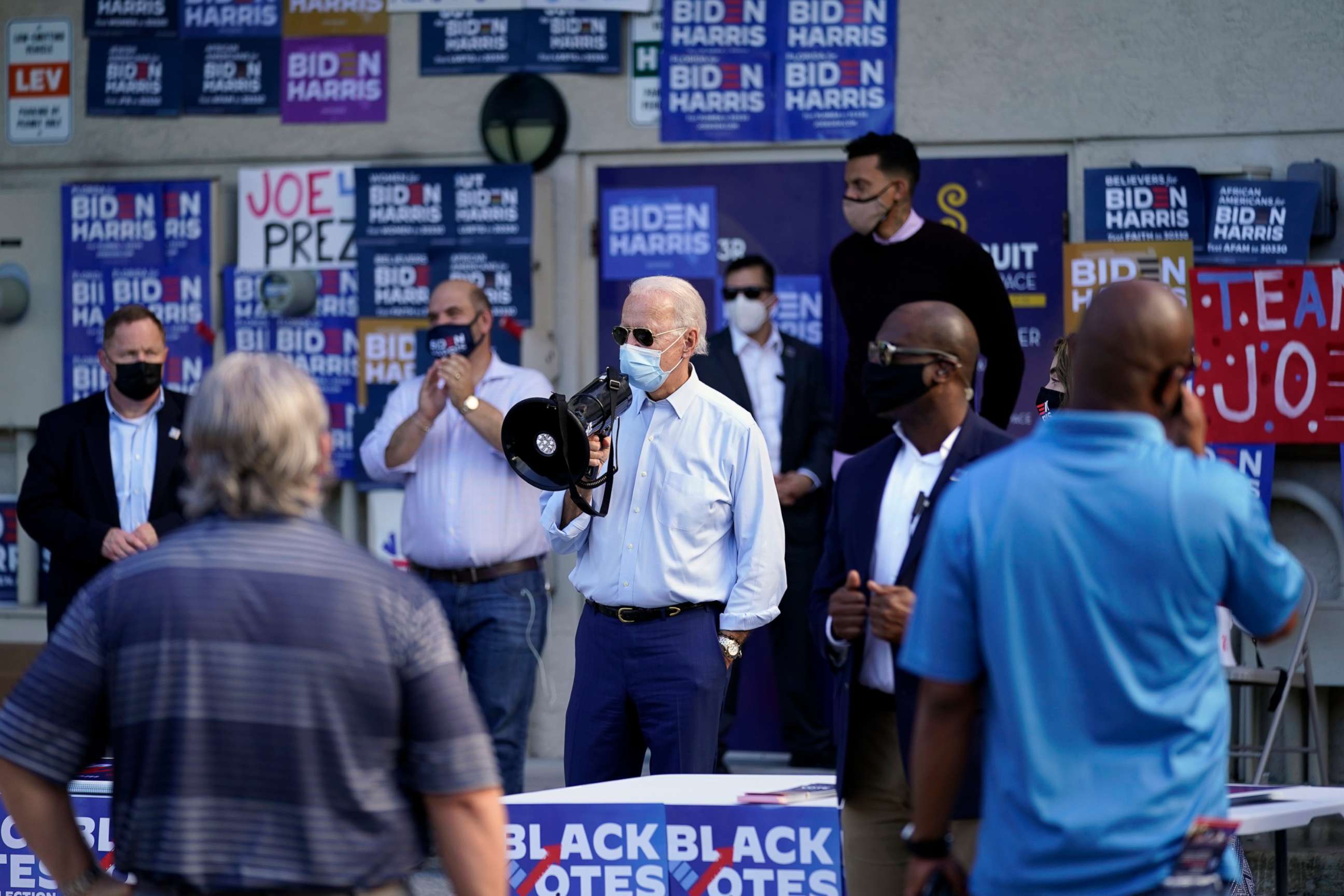PHOTO: Democratic presidential candidate former Vice President Joe Biden speaks to people outside a campaign victory center,  Oct. 29, 2020, in Fort Lauderdale, Fla.