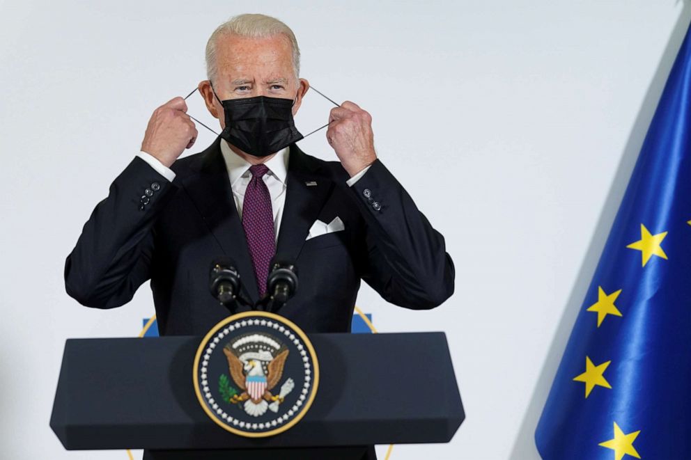 FILE PHOTO: U.S. President Joe Biden adjusts his face mask as he and the European Commission's president, Ursula von der Leyen (not pictured), make a joint statement on the sidelines of the Group of 20 summit summit in Rome, Italy, on Oct. 31, 2021.