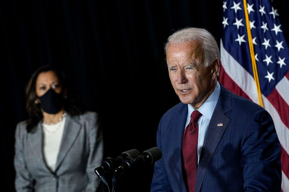 PHOTO: Presumptive Democratic presidential nominee former Vice President Joe Biden speaks while Se. Kamala Harris listens following a coronavirus briefing with health experts at the Hotel DuPont on Aug. 13, 2020, in Wilmington, Del.