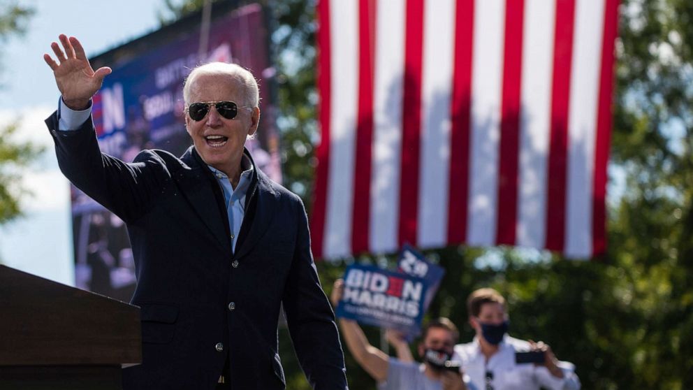 PHOTO: Democratic presidential nominee and former Vice President Joe Biden waves to sympathizers at the end of his speech at the Riverside High School in Durham, North Carolina during a campaign stop, Oct. 18, 2020.