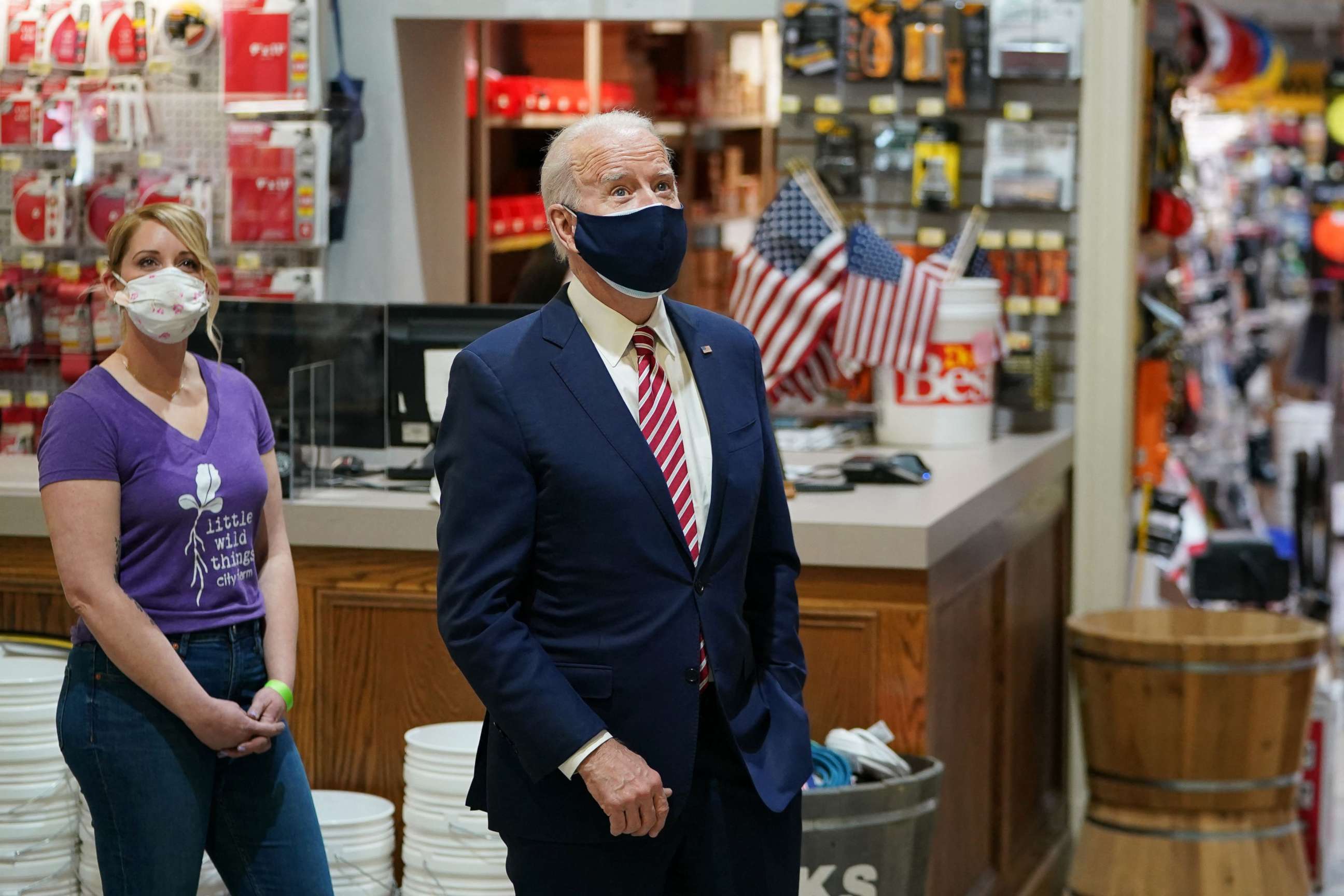 PHOTO: President Joe Biden stands with Mary Anna Ackley inside W.S. Jenks & Son, a hardware store in Washington, D.C, March 9, 2021.