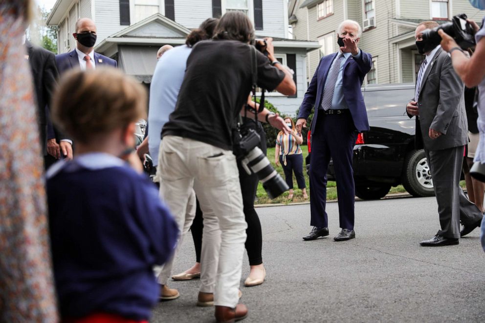 PHOTO: Democratic U.S. presidential candidate and former Vice President Joe Biden waves goodbye after talking to a young local child and news media as he visits the neighborhood where he grew up while campaigning in Scranton, Pa., July 9, 2020.