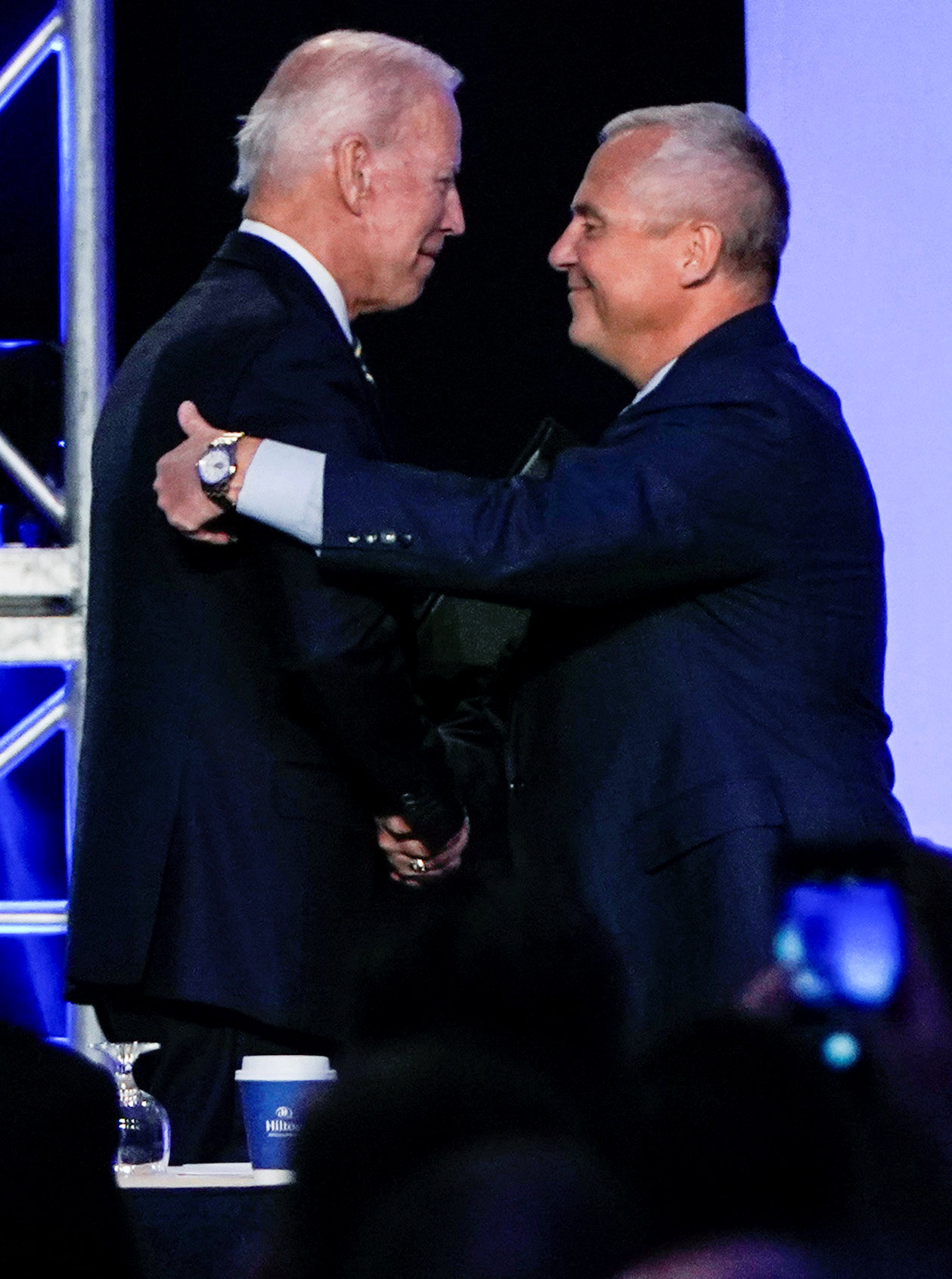 PHOTO: Former Vice President Joe Biden hugs International Brotherhood of Electrical Workers President Lonnie Stephenson before he addresses the IBEW construction and maintenance conference in Washington, April 5, 2019.