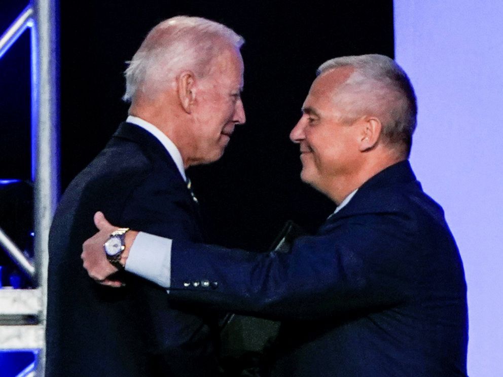 PHOTO: Former Vice President Joe Biden hugs International Brotherhood of Electrical Workers President Lonnie Stephenson before he addresses the IBEW construction and maintenance conference in Washington, April 5, 2019.