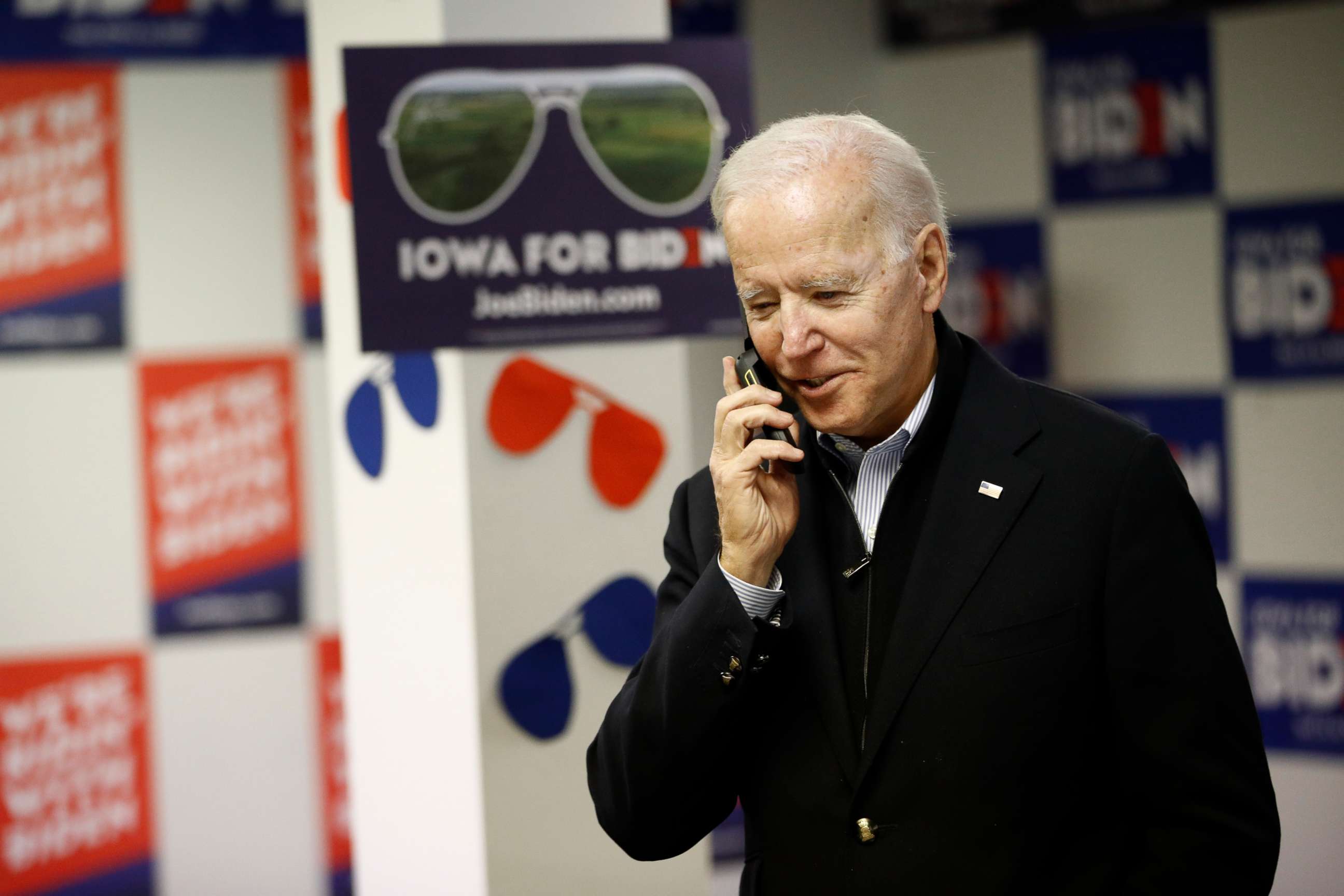 PHOTO: Democratic presidential candidate former Vice President Joe Biden speaks with a potential caucus-goer during a stop at a campaign field office, Monday, Jan. 13, 2020, in Des Moines, Iowa.