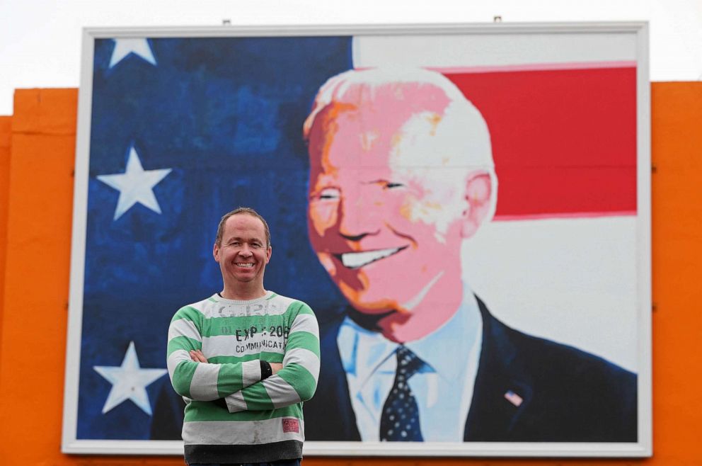 PHOTO: FILE - Joe Blewitt a cousin of US President Joe Biden at a mural of Biden in his ancestral home of Ballina, Co. Mayo, Ireland, where he visited in June 2016 as Vice President.