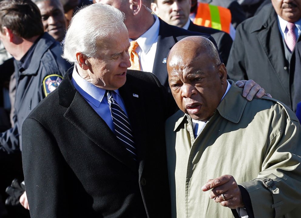 PHOTO: In this March 3, 2013, file photo, Vice President Joe Biden embraces Rep. John Lewis as they prepare to lead a group across the Edmund Pettus Bridge in Selma, Ala.