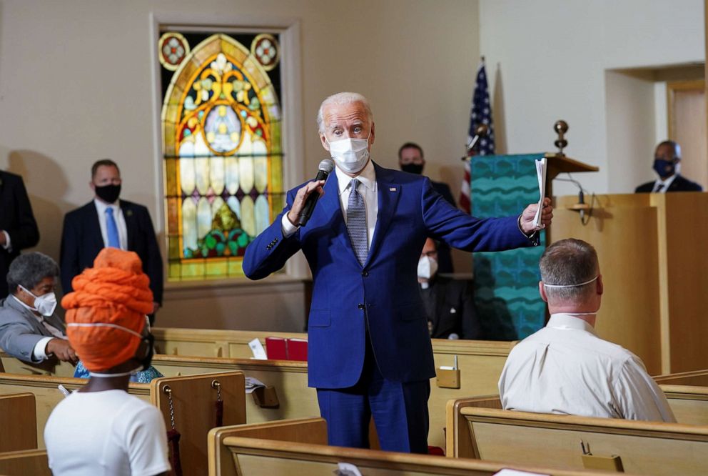 PHOTO: Presidential nominee Joe Biden speaks to residents, including activist Porche Bennett-Bey, during a community meeting at Grace Lutheran Church in the aftermath of the shooting of Jacob Blake, in Kenosha, Wisc., Sept. 3, 2020.