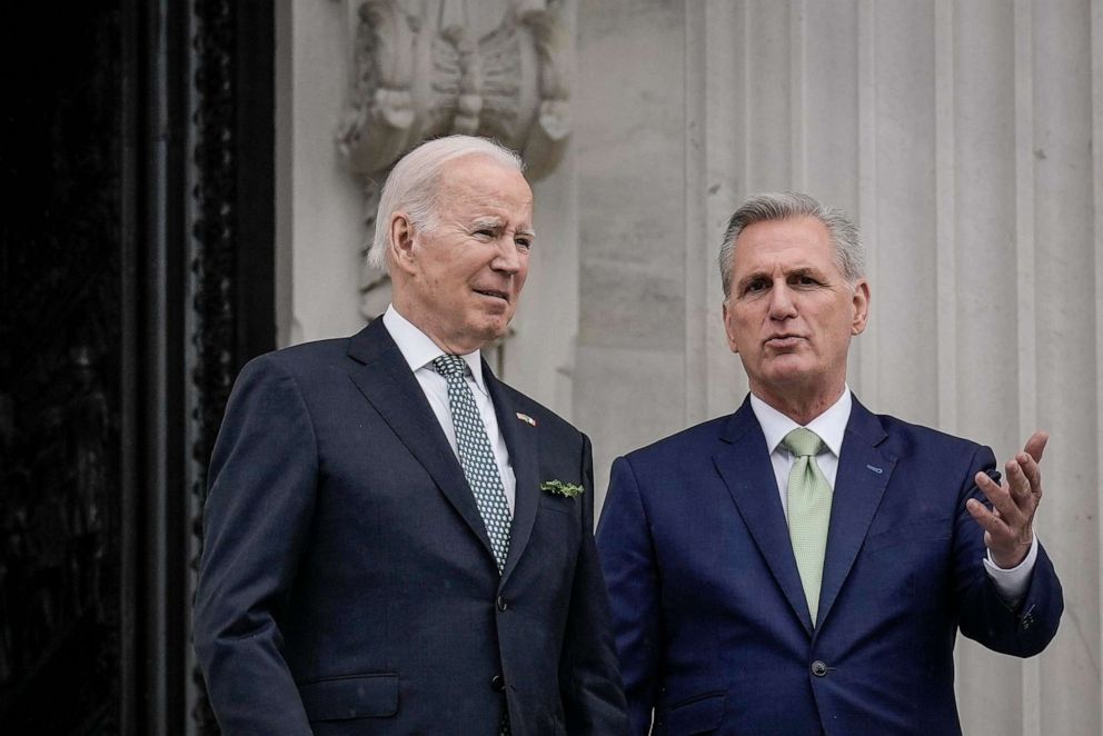 PHOTO: In this March 17, 2023, file photo, President Joe Biden and Speaker of the House Kevin McCarthy talk as they depart the U.S. Capitol on Saint Patrick's Day in Washington, D.C.