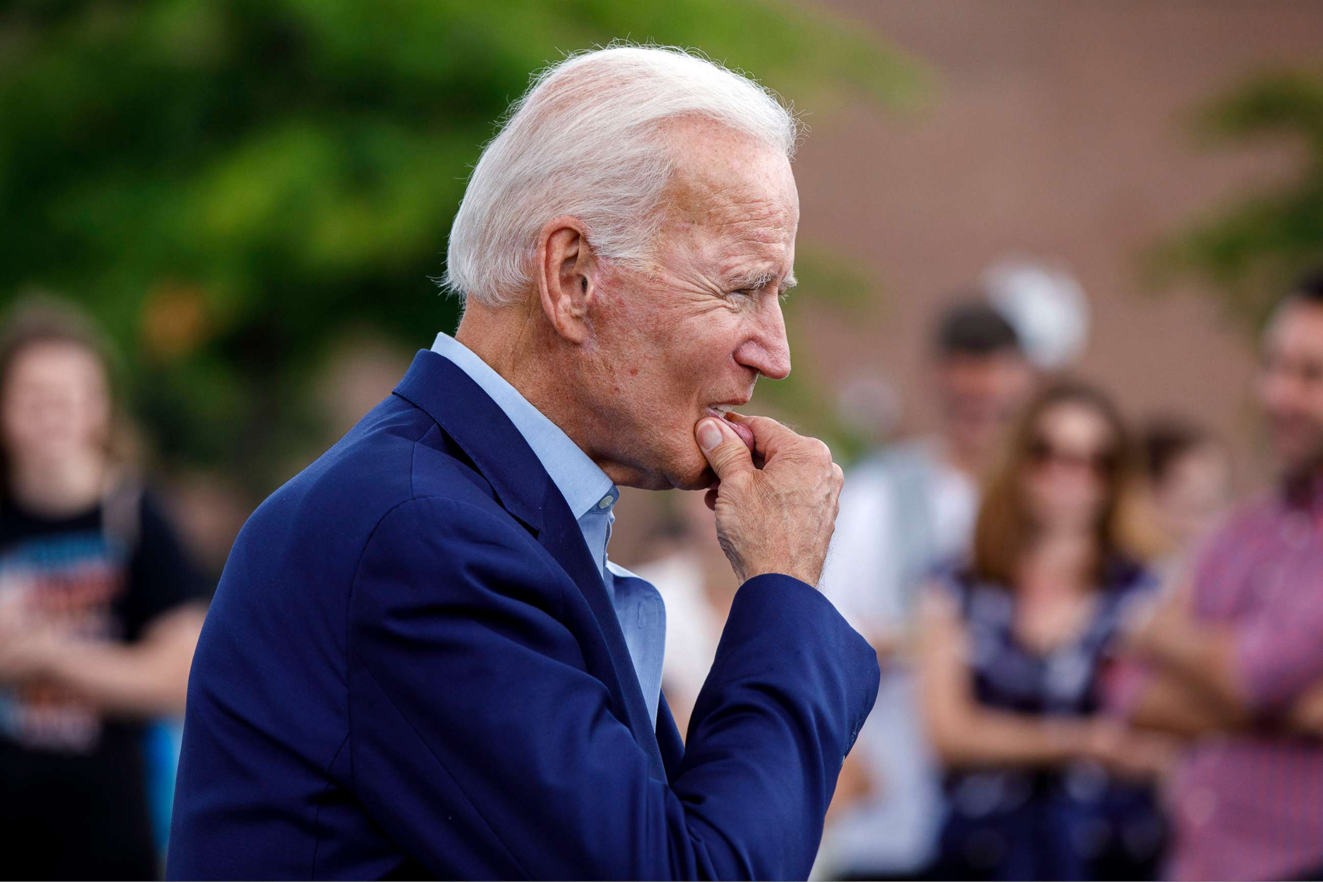 PHOTO: Democratic presidential candidate and former Vice President Joe Biden approaches reporters to answer questions following a campaign stop at Lindy's Diner in Keene, N.H., Aug. 24, 2019. 
