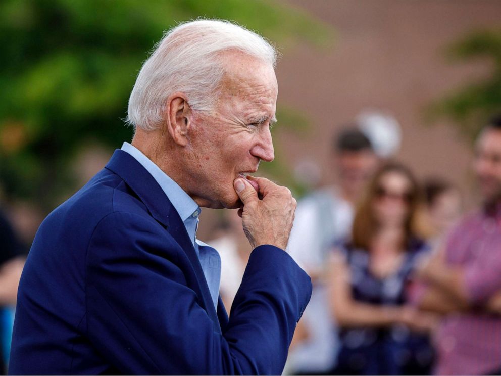 PHOTO: Democratic presidential candidate and former Vice President Joe Biden approaches reporters to answer questions following a campaign stop at Lindys Diner in Keene, N.H., Aug. 24, 2019.