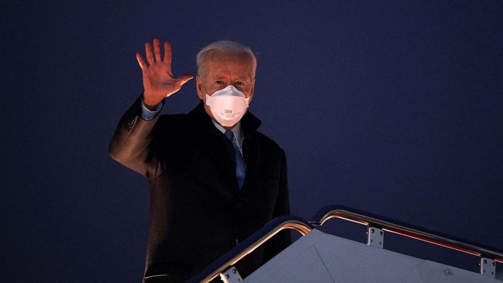 PHOTO: President Joe Biden waves as he boards Air Force One before departing from Andrews Air Force Base in Maryland on Feb. 12, 2021.