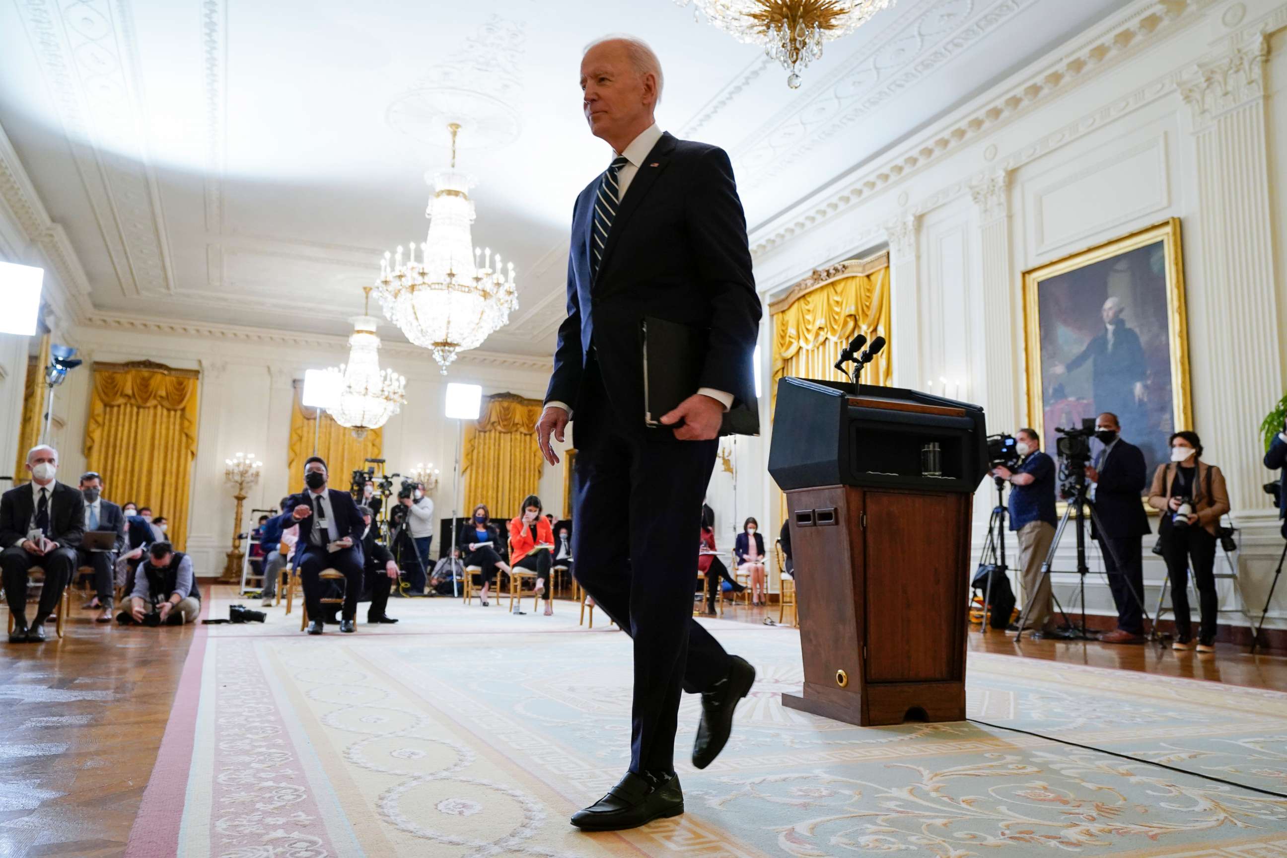 PHOTO: President Joe Biden leaves after speaking at a news conference in the East Room of the White House on March 25, 2021 in Washington.