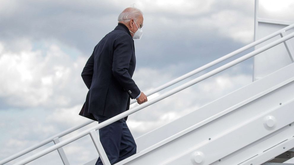 PHOTO: Democratic presidential nominee Joe Biden boards a plane as he departs on campaign travel to Michigan from New Castle Airport in New Castle, Del., Oct. 2, 2020.